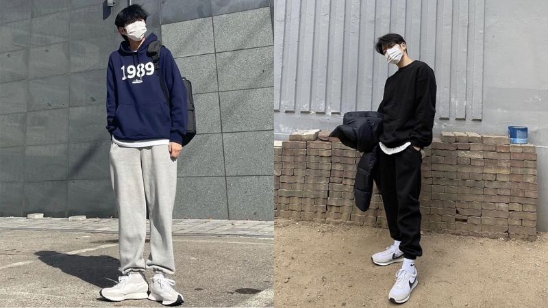 Nam giới mặc áo hoodie đen, quần jogger và giày thể thao đen trắng